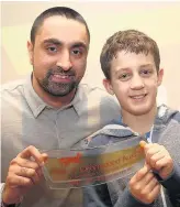  ??  ?? Pictured is Jit Singh, (left) one of the leaders of Shelthorpe Youth Club, with Leon Sheerin, 11, one of the members of the youth club, who won the Youth Club of the Year Award. Picture courtesy of Studio 17