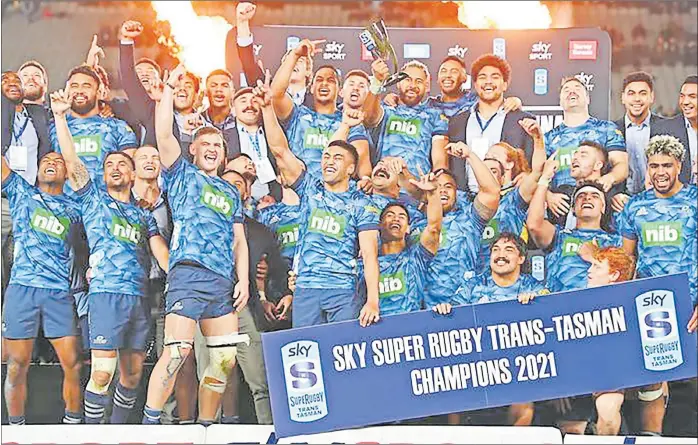  ?? Picture: RNZ ?? Winner... 2021 Trans Tasman Super Rugby champion, the Blues celebrate the win.