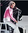  ??  ?? Eternal showman: Barry Manilow performing on American television in 1975, above; and on stage in 2016, top. Below, with his husband, Garry Kief