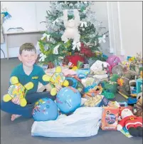  ??  ?? Bradley Scott went shopping for balls and games to help make someone else’s Christmas brighter.