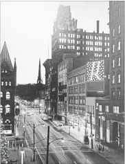  ??  ?? Above: 1962: The west side of James between King and Main, across from Gore Park. Left: While downtown flourishes, this gravel-andasphalt plain remains on James South. That’s the Pigott Building at left. The Royal Bank HQ was next door, until demolition.