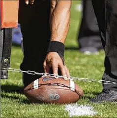  ?? GEORGE FREY/AP 2019 ?? In an effort to reduce the number of plays in games in the name of player safety, the NCAA Football Rules Committee on Friday approved a proposal to keep the clock running when a team makes a first down except in the last two minutes of a half. A final vote is set for April 20.