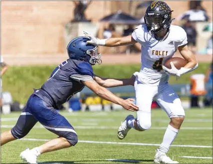  ?? TIMOTHY ARRICK PHOTOS — FOR MEDIANEWS GROUP ?? Bishop Foley’s Jackson Zeiter, right, fends off Cranbrook’s Shane Wittenberg during the Ventures 43-41loss to the Cranes on Saturday.