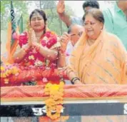  ?? HT PHOTO ?? Chief minister Vasundhara Raje along with BJP candidate Shobha Rani Kushwaha campaigns in Dholpur on Friday.