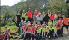  ??  ?? Youngsters from Dervaig Primary School rest their legs on their fundraisin­g walk to Calgary.