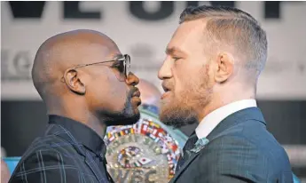  ?? JOHN LOCHER, AP ?? Floyd Mayweather Jr. and Conor McGregor crossed the line in the buildup.