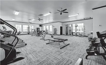  ?? Fitness center at Woodland Park in Edmond, one of Caliber Developmen­t Co.'s three residentia­l developmen­ts. ??