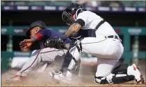  ??  ?? Minnesota Twins’ Jorge Polanco is tagged out by Detroit Tigers catcher Grayson Greiner during the tenth inning of Tuesday’s game in Detroit.