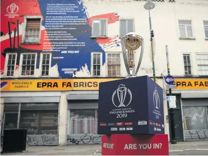  ?? Picture: Getty Images ?? THE PRIZE. The ICC Cricket World Cup trophy on display in Brick Lane in London in front of the World Cup declaratio­n mural by London poet Caleb Femi. Today marks 100 days until the World Cup.