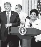  ?? SARAH SILBIGER/THE NEW YORK TIMES 2019 ?? President Trump stands with Alice Marie Johnson, whose life sentence he commuted.