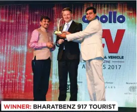  ??  ?? WINNER: BHARATBENZ 917 TOURIST (L to R) Ramashanka­r Pandey, Managing Director, Hella India Lighting, Markus Villinger, Managing Director, Daimler Buses India and Vice President, Daimler India Commercial Vehicles, and Sabyasachi Gosh, Corporate...