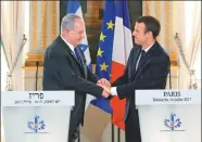  ?? STEPHANE MAHE VIA ASSOCIATED PRESS ?? Israeli Prime Minister Benjamin Netanyahu and French President Emmanuel Macron meet at the Elysee Palace in Paris on Sunday.