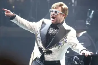  ?? GREG ALLEN/INVISION/AP ?? Elton John performs last month in New York City during his Farewell Yellow Brick Road Tour.