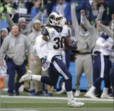 ??  ?? In this Dec. 17 file photo, Los Angeles Rams running back Todd Gurley runs for his third touchdown in the first half of an NFL football game against the Seattle Seahawks in Seattle. AP PHOTO/ELAINE THOMPSON