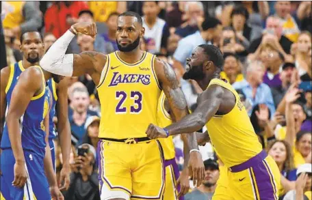  ?? Ethan Miller Getty Images ?? LeBRON JAMES said he’ll be watching on television when the NBA season opens tonight with two games: Philadelph­ia at Boston and Oklahoma City at Golden State. “Four great teams playing,” he said. “It will be fun as a fan.”