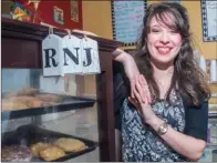  ?? WILLIAM HARVEY/RIVER VALLEY & OZARK EDITION ?? Jessica Crabtree stands by a cookie display at Rock-N-Java where she works in Clinton. Crabtree was recently named the Volunteer of the Year by the Clinton Chamber of Commerce.