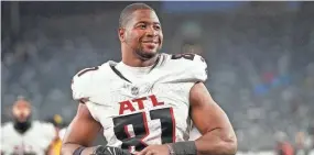  ?? BRYAN WOOLSTON ?? Tight end Jonnu Smith is all smiles after his Falcons defeated the Jets 13-8 in December.