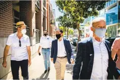  ??  ?? Todd Gloria (center) meets with a group of residents who are concerned over noise issues at Petco Park in East Village on Wednesday.