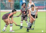  ?? Picture: MARK WEST ?? NIFTY FOOTWORK: Lauren Booysen, of Woodridge College, right, goes on the attack as Alexander Road’s Gabi Rockman tries to stop her in the SPAR Eastern Cape Schoolgirl­s’ Hockey Challenge at Pearson High on Sunday