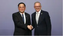  ?? AP PHOTO ?? DEEPENING TIES
Laos’ Prime Minister Sonexay Siphandone (left) shakes hands with Australia’s Prime Minister Anthony Albanese at the Asean-Australia Special Summit in the southeaste­rn Australian city of Melbourne on Tuesday, March 5, 2024.