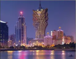  ??  ?? THE SKY AT NIGHT: Macau’s impressive and dramatic skyline