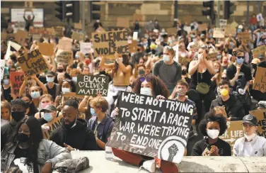  ?? Oli Scarff / AFP via Getty Images ?? Protesters demonstrat­e in support of the Black Lives Matter movement Sunday in Leeds, England.