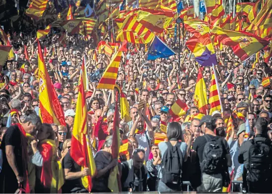  ??  ?? FLAG WAVING: We all know what happened in Catalonia when the emotion faded and the details emerged: The revolution failed.