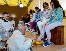  ?? Vatican Media/associated Press ?? Pope Francis partakes in a foot-washing ceremony on Thursday that is a hallmark of every Holy Week and recalls the foot-washing Jesus performed on his 12 apostles at their last supper together before he was crucified.