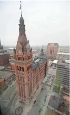  ?? MIKE DE SISTI / MILWAUKEE JOURNAL SENTINEL ?? Milwaukee’s City Hall is seen from the 35th floor of the new BMO Tower, 790 N. Water St. Plans are in place to have the building open for use on April 17.