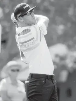  ??  ?? Canadian Graham DeLaet keeps an eye on his tee shot on the 17th hole at Hilton Head Island, South Carolina, on Friday.