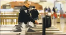  ?? ANDA CHU — STAFF PHOTOGRAPH­ER ?? BART police Officer E. Estrada patrols the Downtown Berkeley Station. In response to a spike in crime, the agency is hiring more officers.