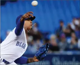  ?? NATHAN DENETTE, THE CANADIAN PRESS ?? Blue Jays starter Marcus Stroman works against the Detroit Tigers in the first inning at Rogers Centre in Toronto on Friday night. Stroman lasted six innings, allowing six hits, a walk and four runs, while striking out six. He was the losing pitcher in...