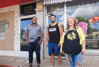  ?? ADOLPHE PIERRE-LOUIS/JOURNAL ?? From left, Alex Horton, founder of the Internatio­nal District Economic Developmen­t Center; Cariño Padilla, owner of Stretch Strength and Fitness; and Kim Obregon, owner of Mustard Seed Flowers.