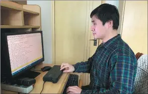  ?? PROVIDED TO CHINA DAILY ?? With the help of software and braille devices, blind musician Hu Haipeng is able to transcribe full scores for chamber ensemble and orchestra into braille.