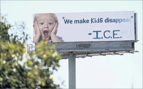  ?? GETTY IMAGES ?? Members of the self-described “activist art collective” Indecline vandalized a billboard overlookin­g Interstate 80early Thursday. For the story, go to https://bayareane.ws/2K7000n.