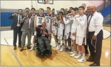  ?? ED MORLOCK — DIGITAL FIRST MEDIA ?? Faith Christian Academy poses after beating Girard College, 48-46 in overtime, in the District 1 Class-A championsh­ip game Saturday at Bensalem.