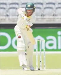  ?? Associated Press ?? Australia’s Marcus Harris plays a shot against India during their second Test match in Perth on Friday.