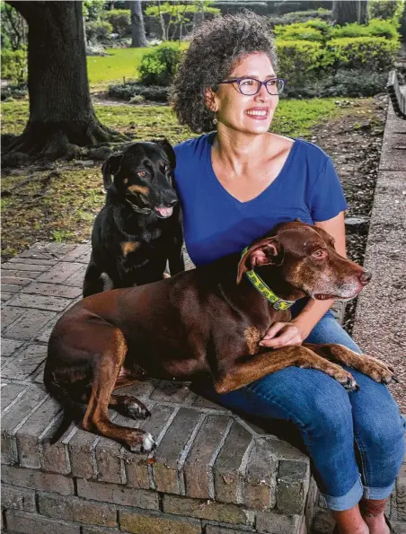  ?? Photos by Gary Fountain / Contributo­r ?? Pupfit co-founder Jennifer Lopez took in her two rescue dogs — Hazel and Xena — about the same time she started the business.