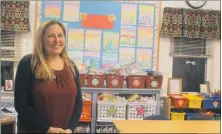  ?? STAFF PHOTO BY JAMIE ANFENSON-COMEAU ?? Jill Rison, art instructor at St. Mary’s Bryantown Catholic school, displays her classroom during open house Tuesday evening.