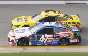  ?? John Raoux / Associated Press ?? Ryan Preece (47) and Michael McDowell (34) race side by side during a practice session for the NASCAR Daytona 500 on Friday in Daytona Beach, Fla.