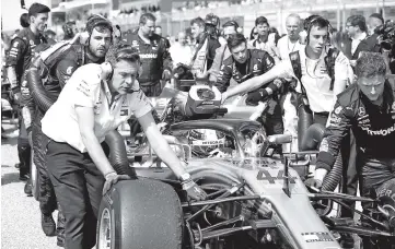  ??  ?? Lewis Hamilton of Great Britain driving the (44) Mercedes AMG Petronas F1 Team Mercedes WO9 is pushed onto the grid before the United States Formula One Grand Prix at Circuit of The Americas in Austin, United States. - AFP photo