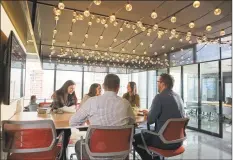  ?? Diageo North America / Contribute­d photo ?? Diageo employees at the company’s new headquarte­rs office at 3 World Trade Center in New York City.