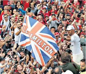  ??  ?? Motivation: Lewis Hamilton was spurred on by the clusters of British supporters