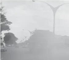  ??  ?? A bus makes its way along Robert Mugabe Way giving out cloudy exhaust gas causing air pollution as well as obstructio­n to other motorists recently. — Picture by Dennis Mudzamiri