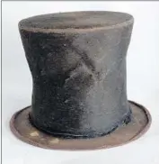  ??  ?? LINCOLN’S iconic stovepipe hat is displayed at the library, though some doubt its authentici­ty. Officials say they would sell Lincoln items only as a last resort.