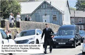  ??  ?? A small service was held outside All Saints Church in Trealaw, Rhondda, by Reverend Peter Gale