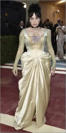  ?? THE ASSOCIATED PRESS a Gucci high-corset ?? CLASSIC STYLE: Billie Eilish wears green and gold dress to The Metropolit­an Museum of Art’s Costume Institute gala.