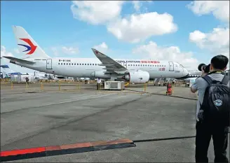  ?? THEN CHIH WEY / XINHUA ?? A C919 passenger jet is displayed at the Singapore Airshow in Singapore.