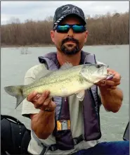  ?? (Arkansas Democrat-Gazette/Bryan Hendricks) ?? Steve Dunlap of Hot Springs caught nearly 20 bass like this one Thursday while fishing from his kayak at Lake Ouachita.