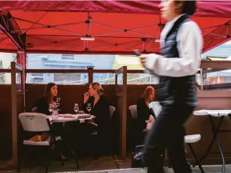  ?? Carlos Avila Gonzalez / The Chronicle ?? Diners at Terzo restaurant. Sidewalks throughout the Bay Area are now dotted with parklets.